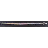 An 18ct white gold bracelet set with vari-coloured, mixed-cut coloured sapphires,: some synthetic,