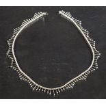 A fringed choker necklace set with round, brilliant-cut diamonds,
