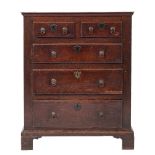 An early George III oak chest of drawers, circa 1765,: the cleated top with moulded edges,