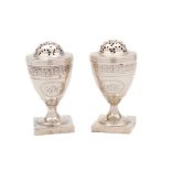 A pair of George III silver pepperettes, maker Duncan Urquhart & Naphtali Hart, London,