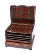 A Victorian burr amboyna, ebonised and brass inlaid humidor: of serpentine outline,