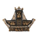 A Chinese carved wood and gilt decorated screen: of arched outline, surmounted by dragons,