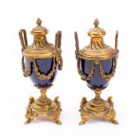 A pair of Sevres-style cobalt blue and gilt-metal mounted cassolettes: in the Louis XVI manner,