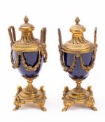 A pair of Sevres-style cobalt blue and gilt-metal mounted cassolettes: in the Louis XVI manner,