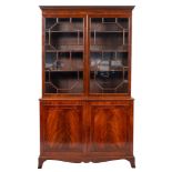 A late George III mahogany and glazed cabinet bookcase, early 19th century,