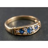 A 9ct gold, sapphire and round, brilliant-cut diamond ring,: total diamond weight 0.