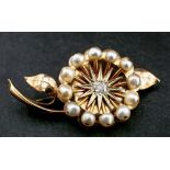 A cushion-cut diamond and pearl flower brooch,: estimated diamond weight ca. 0.