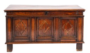 An oak and parquetry coffer, first half 17th century,: the hinged cover with moulded edges,