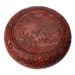 A Chinese carved cinnabar lacquer box and cover: of circular form,