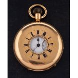 An 18ct gold half hunter keyless pocket watch: the movement having an engraved balance cock to the