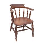 An elm and oak smoker's bow tub elbow chair, first half 19th century,