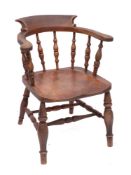 An elm and oak smoker's bow tub elbow chair, first half 19th century,