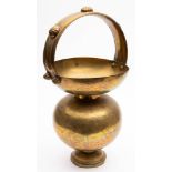 An Indian brass spittoon: of ovoid form with loop handle, decorated with scenes of a tiger hunt,