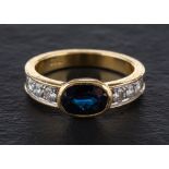 A sapphire and round, brilliant-cut diamond ring,: calculated sapphire weight ca. 1.