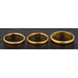 Three 22ct gold bands,: ring sizes L1/2, M and R, total weight ca. 8.4gms.