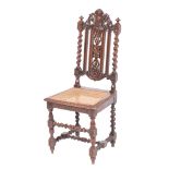 A carved oak and canework chair in Charles II style, late 19th century,