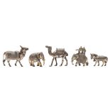 A collection of five Indian white metal animal models: includes, camel, horse, ox and two elephants,