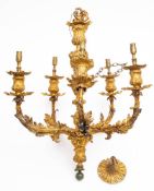 A 19th century gilt brass five branch chandelier: with foliate and fluted sconces,