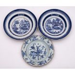 A pair of Chinese porcelain plates and one other: the former painted with an extensive lakeside