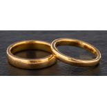 Two 22ct gold band rings,: one with hallmarks for Birmingham, 1962,