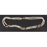 A two row cultured pearl necklace with sapphire spacers,