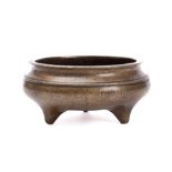 A Chinese bronze tripod censer: of squat circular form,