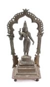 An Indian bronze standing figure of the goddess Menakshi of Madurai: holding a bird in her right