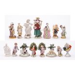 A mixed lot of Continental hard paste porcelain figures: including two pairs of bocage figures in