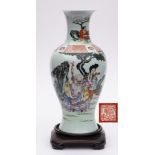 A Chinese famille rose baluster vase: enamelled with a presentation scene depicting the Immortal