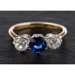 A cushion-cut synthetic sapphire and old-cut diamond three stone ring,