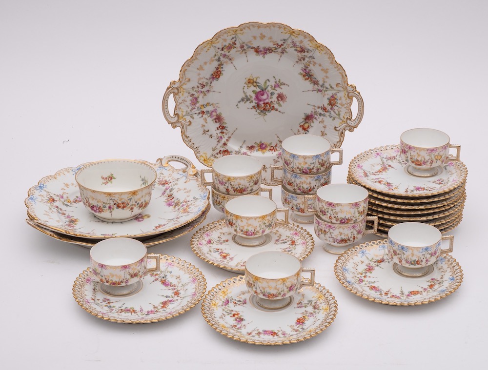 A Dresden porcelain part tea service: painted overall with floral bouquets,
