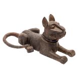 A Benin bronze statue of a recumbent leopard: with pricked ears and all over circular punched