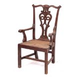 A mahogany and rush seated master's elbow chair in Chippendale style, last quarter 19th century,