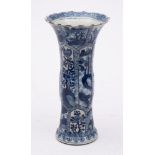 A Chinese blue and white vase: of moulded Gu form with serrated rim,