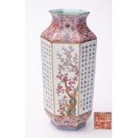 A Chinese inscribed famille rose vase: of hexagonal form with waisted neck and everted rim,