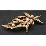 A 9ct gold cultured pearl and ruby brooch of foliate design,: diameter of cultured pearls ca. 3.