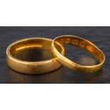Two 22ct gold band rings,: both with hallmarks for Birmingham, one, 1984, ring size L; the other,