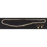 A graduated cultured pearl necklace and a pair of cultured pearl earrings,