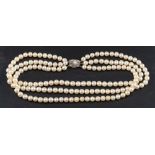 A three row, cultured pearl necklace of uniform size,