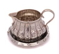 A Victorian silver cream jug, maker's mark worn, London,