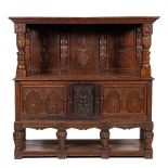 A carved oak court cupboard or duodarn, elements possibly early 17th century and later,