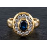 A sapphire and diamond cluster ring,: calculated sapphire weight ca. 0.