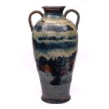 A monumental Malaysian two handled stoneware vase: of baluster form,