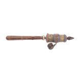 A Tibetan prayer wheel: with wooden and enamel bound spinning top with chained weight,