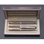 A Parker (USA) Sterling silver fountain pen and ball pen in Cisele pattern: and a matching French