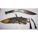 A Malayan Kukri: with 34cm single edged blade, horn grip,