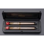 A Parker Sonnet silver pens set: fountain pen and roller ball,