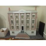 A late 20th century Georgian style dolls house:, with double pitched roof,