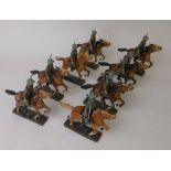 Lineol, eight mounted Cavalry troopers on galloping horses: includes officer figure.