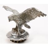 A nickel plated Desmo style Eagle car mascot: with outstretched wings, mounted on a radiator cap,